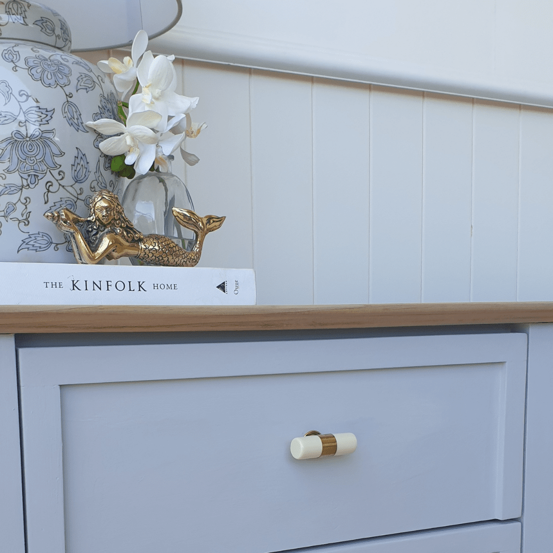 Brass Mermaid ontop of coastal style styling vignette