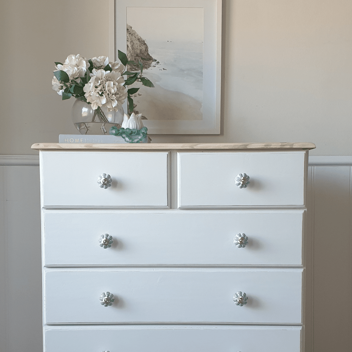 floral ceramic knob with coastal style tallboy